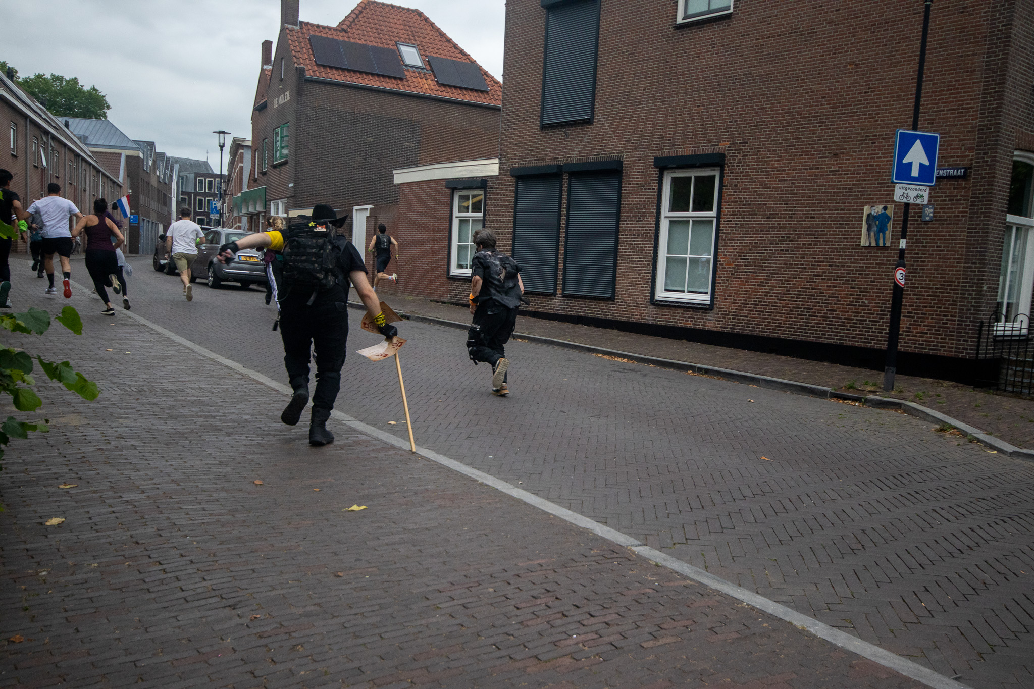 Survivors running through the streets of Woerden