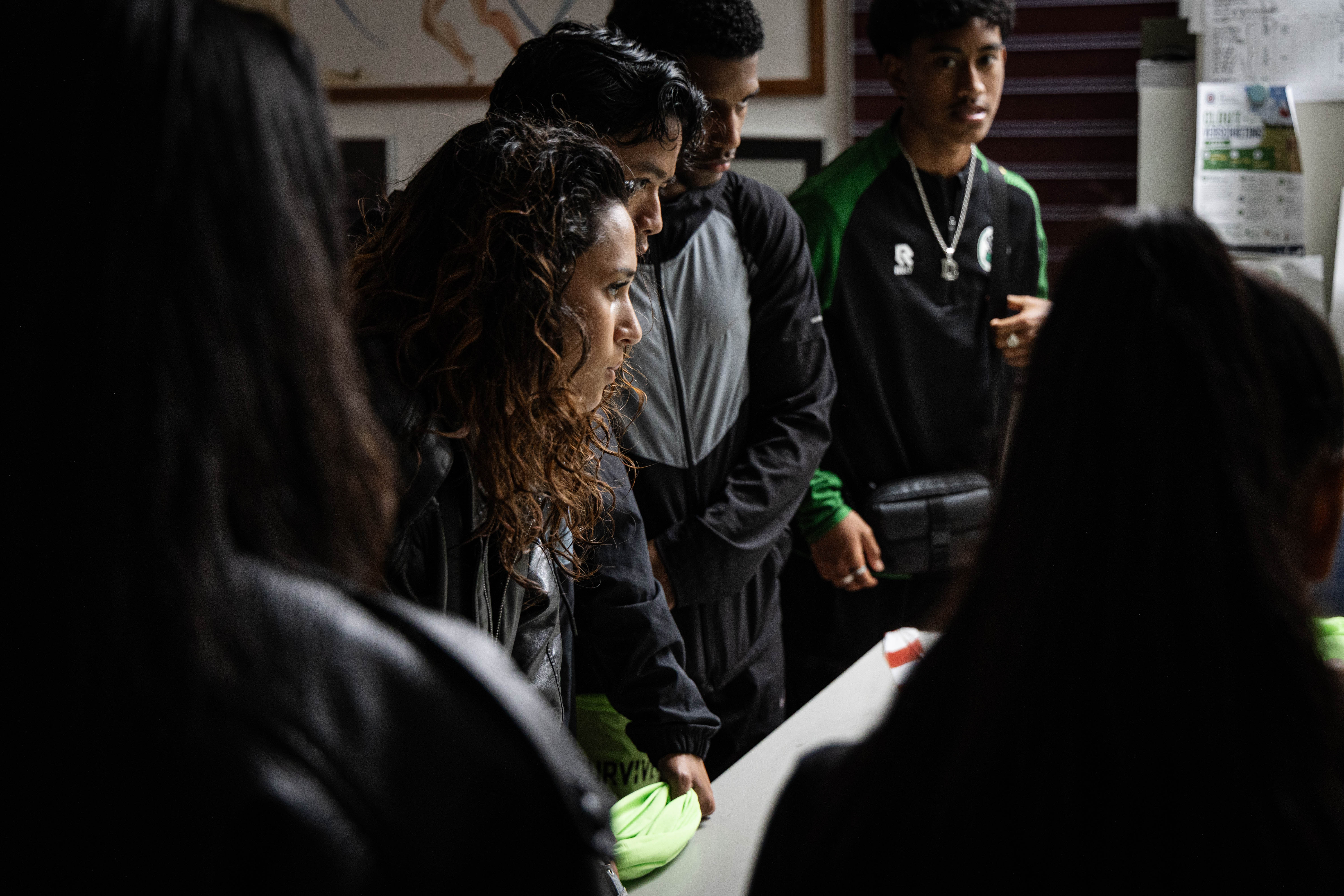 Survivors at check-in, green scarves in hand