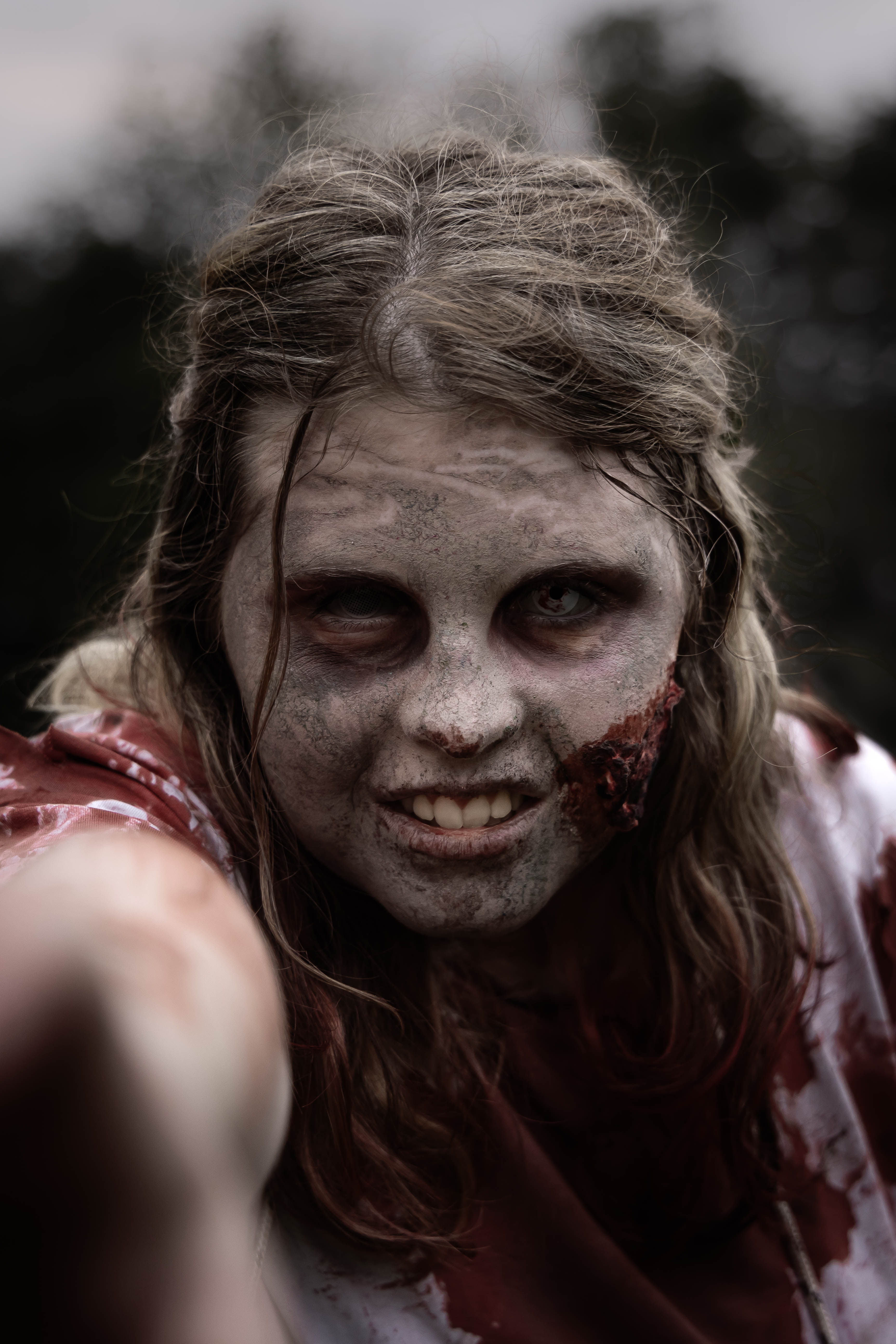 A turned survivor in full makeup, back out with the horde